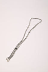 Collana lunga tubolare con strass