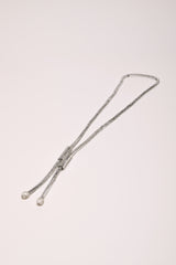 Collana lunga tubolare con strass
