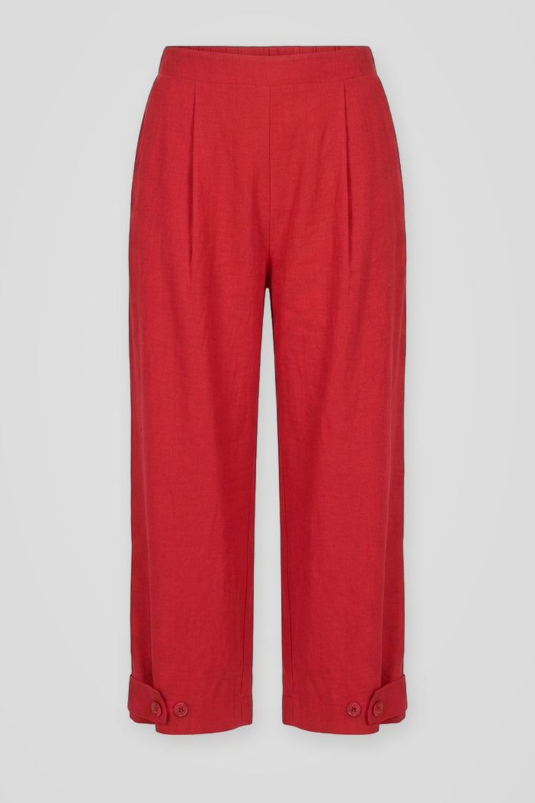 Pantaloni cropped rossi con bottoni al fondo