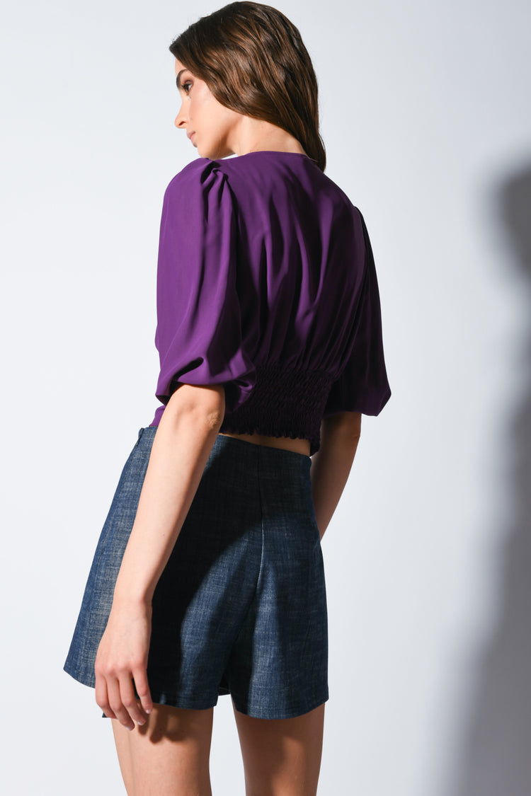 Blusa crop con scollo a V