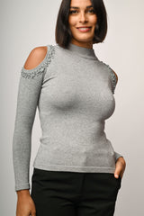 Lupetto con cut-outs e perline