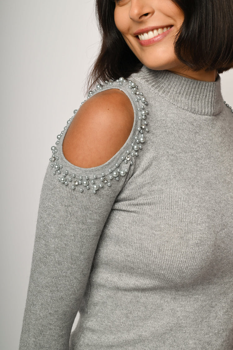 Lupetto con cut-outs e perline