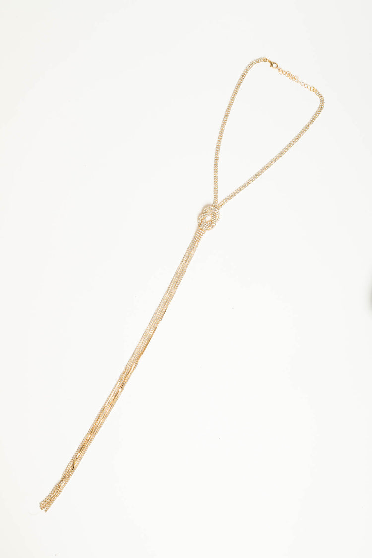 Collana lunga oro con nodo geometrico e strass